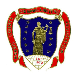 Logo of the Criminal Justice Association featuring a stylized scale and shield design in blue and gold colors.